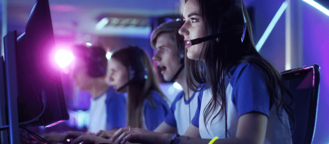 teenagers playing video games at computers